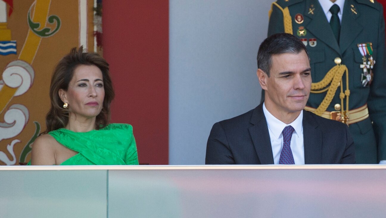 Spanish Prime Minister Pedro Sanchez and Acting Minister of Transport, Mobility and Urban Agenda Raquel Sanchez watch a military parade at the Plaza de Canovas del Castillo in Madrid, Oct. 12, 2023. (Alberto Ortega/Europa Press via Getty Images)