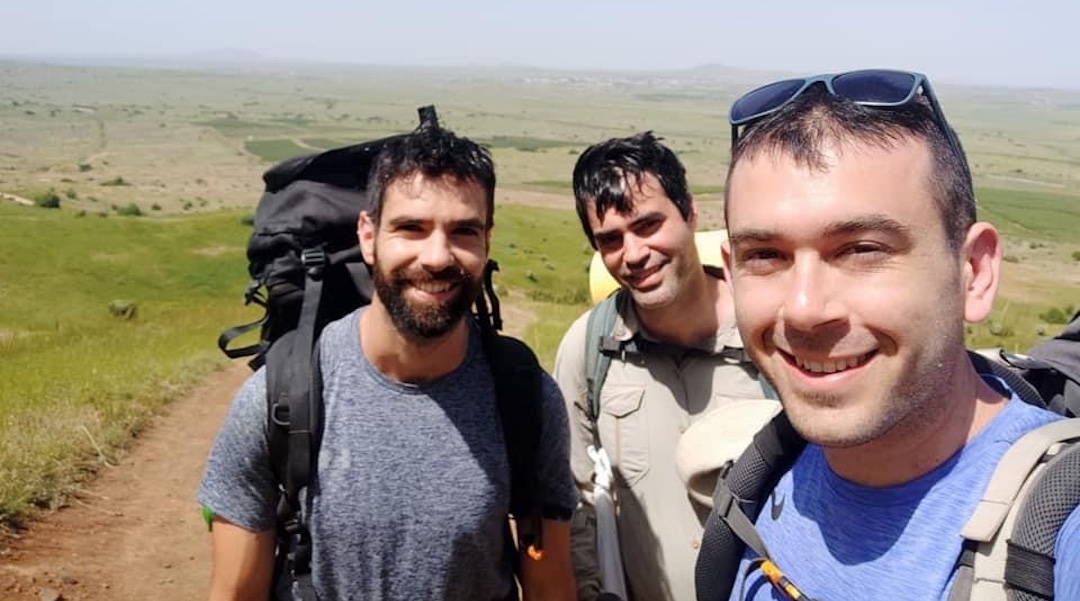 Iddo Gefen, center, seen hiking with his friend Sagi Golan, left, and another friend in an undated photo. (Courtesy of Gefen)