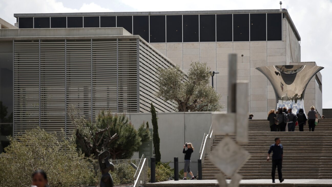 Visitors to the Israel Museum explore the exterior sculpture garden. (AFP via Getty)