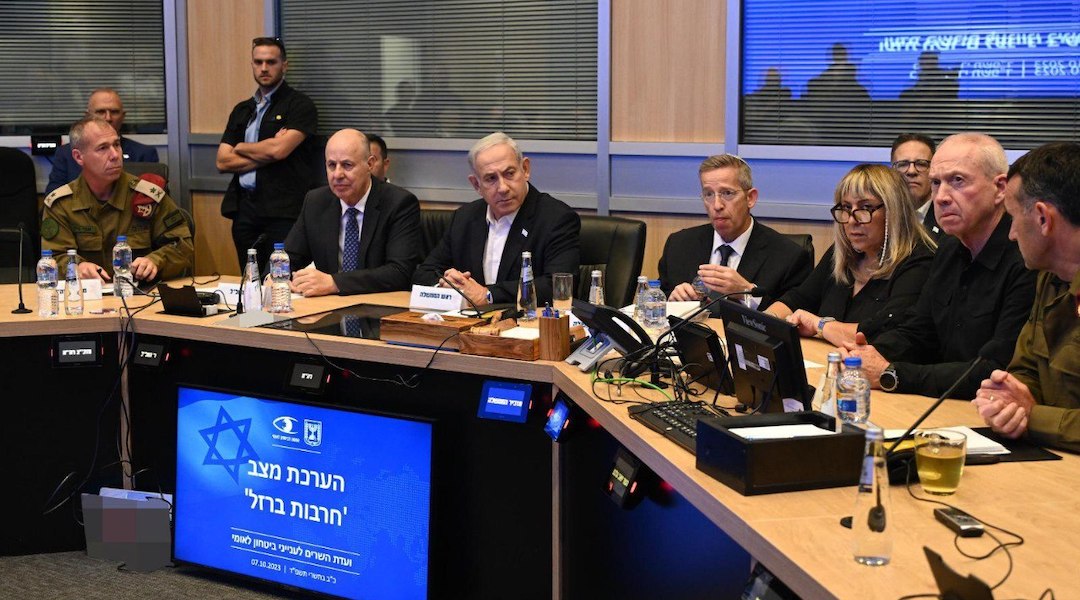 Israeli Prime Minister Benjamin Netanyahu, seated third from left, holds a meeting with his security cabinet in Tel Aviv, Oct. 7, 2023. (Haim Zach/GPO/Anadolu Agency via Getty Images)