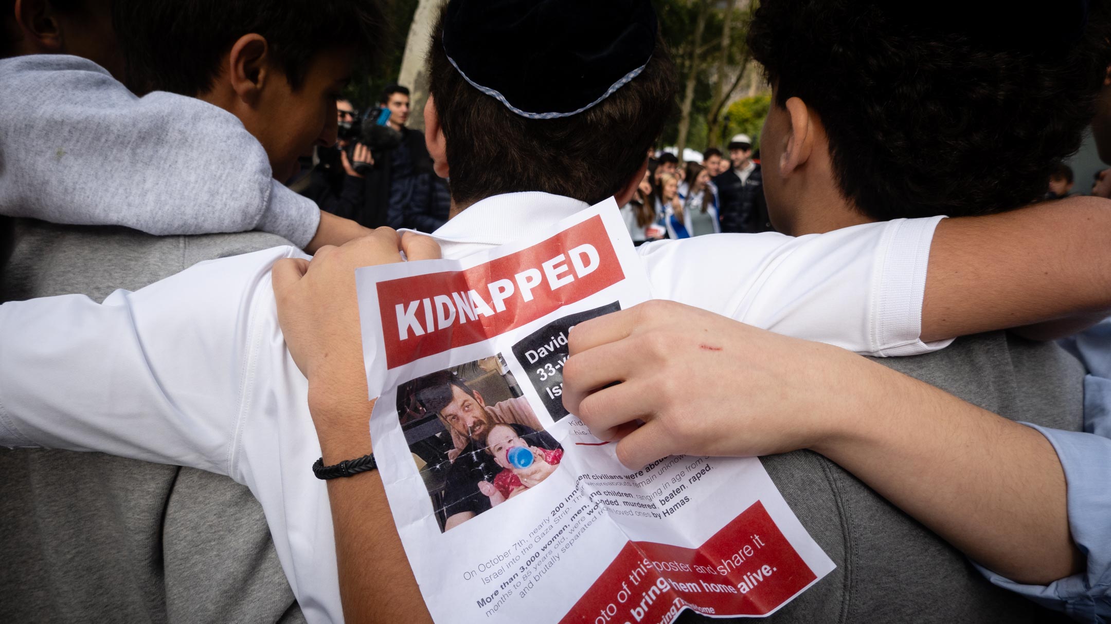 Students hold images of Israeli hostages held by Hamas at a rally demanding their release, in New York City, October 18, 2023. (Luke Tress)