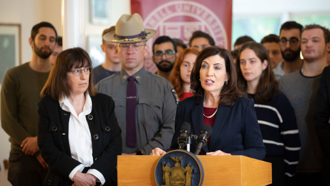 New York Gov. Kathy Hochul, at the podium, with Cornell President Martha Pollack, on the university campus in Ithaca, New York, Oct. 30, to address threats to Jewish students.