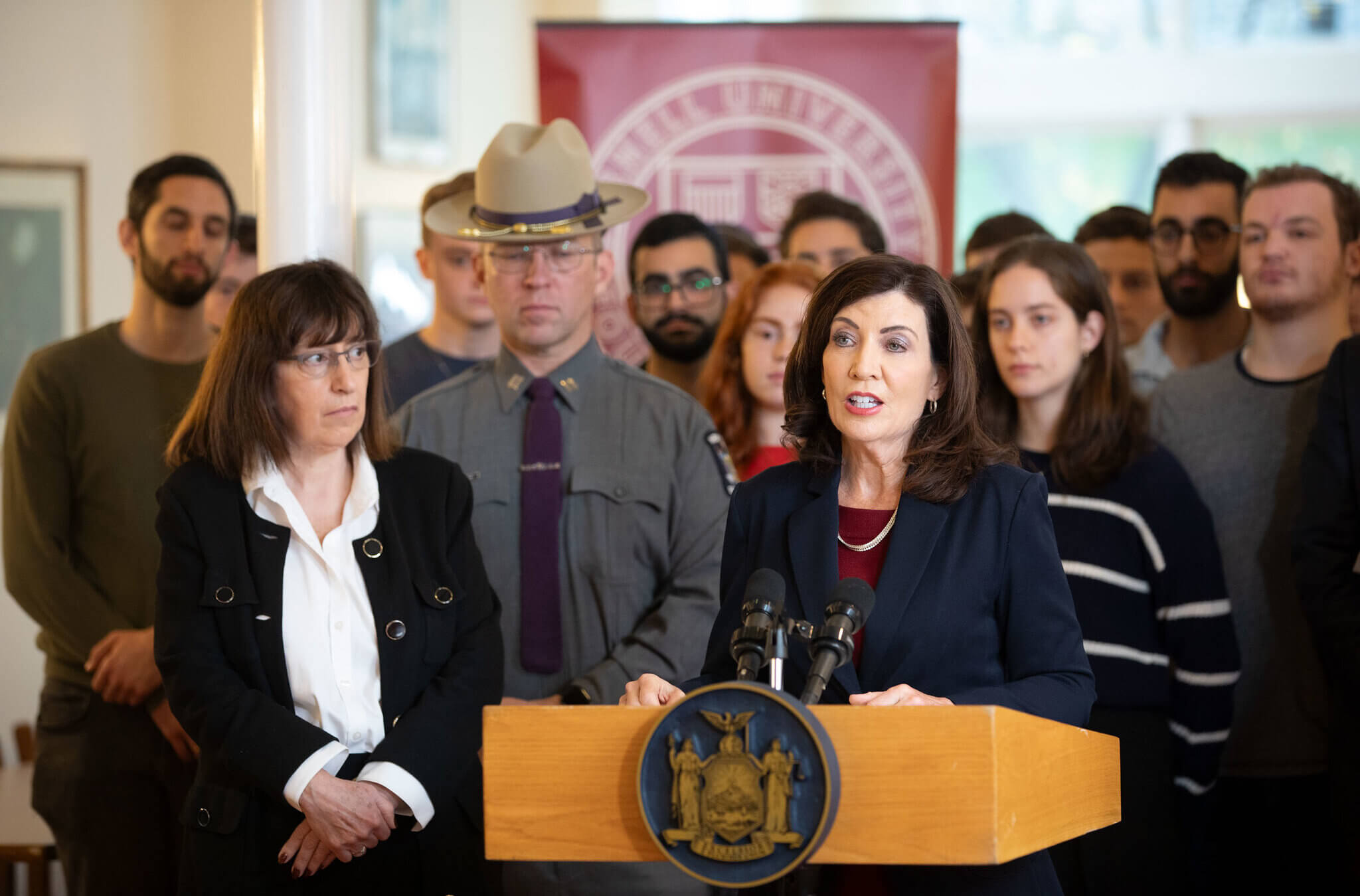 New York Gov. Kathy Hochul, at the podium, with Cornell President Martha Pollack, on the university campus in Ithaca, New York, Oct. 30, to address threats to Jewish students.