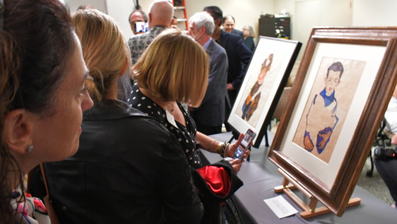 Onlookers view works by Egon Schiele from Fritz Grünbaum’s extensive private collection, now returned to his heirs in a ceremony in New York on Sep. 20, 2023. (Jackie Hajdenberg)