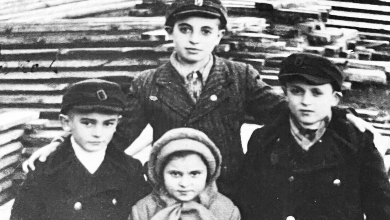 Childhood photo of Sam Rakowski Ron with his little brother Israel (who died in Mauthausen), cousin Masha Deena (who died in another camp) and Samuel Banach, who survived.