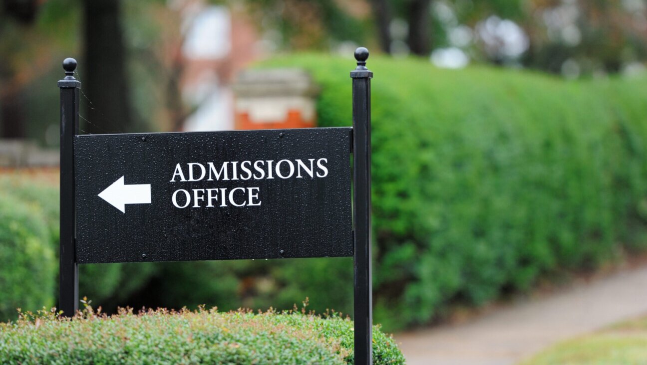 Close up of admissions office sign near a university campus. (Getty Images)