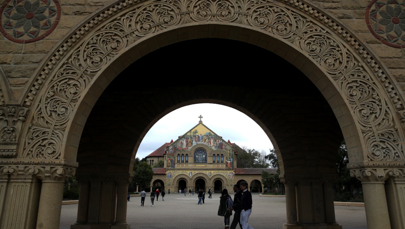 Students and visitors walk on the Stanford University campus in California. 