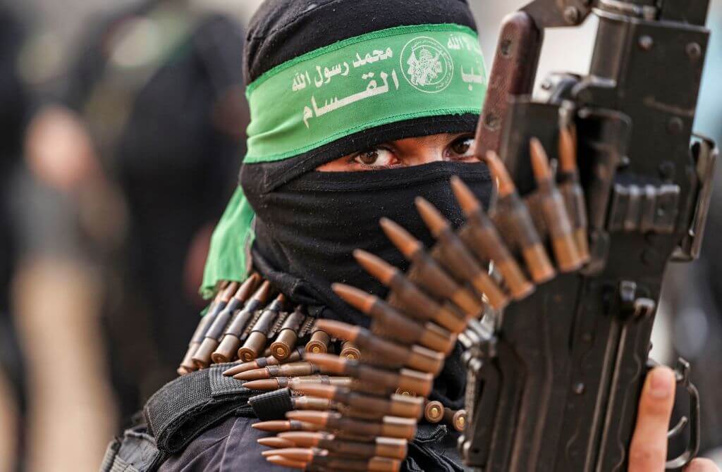  A member of Ezzedine al-Qassam Brigades, military wing of the Palestinian Hamas movement, takes part in a parade in Gaza City on November 14, 2021. 