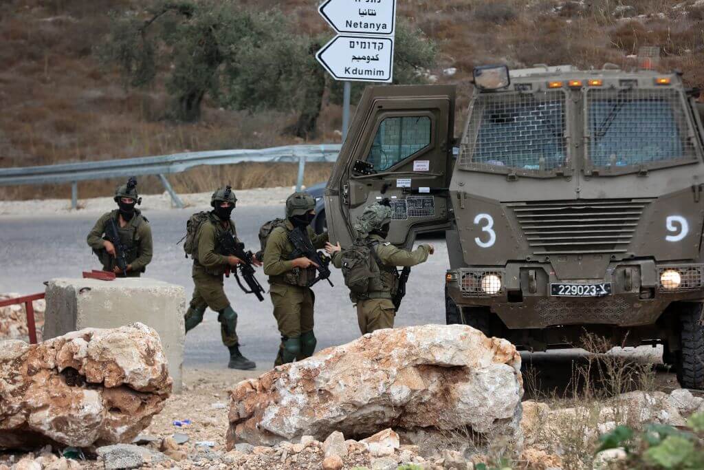 Israeli soldiers patrol near the West Bank city of Tulkarm where two Palestinians were reportedly killed during clashes with Israeli forces on October 5, 2023.