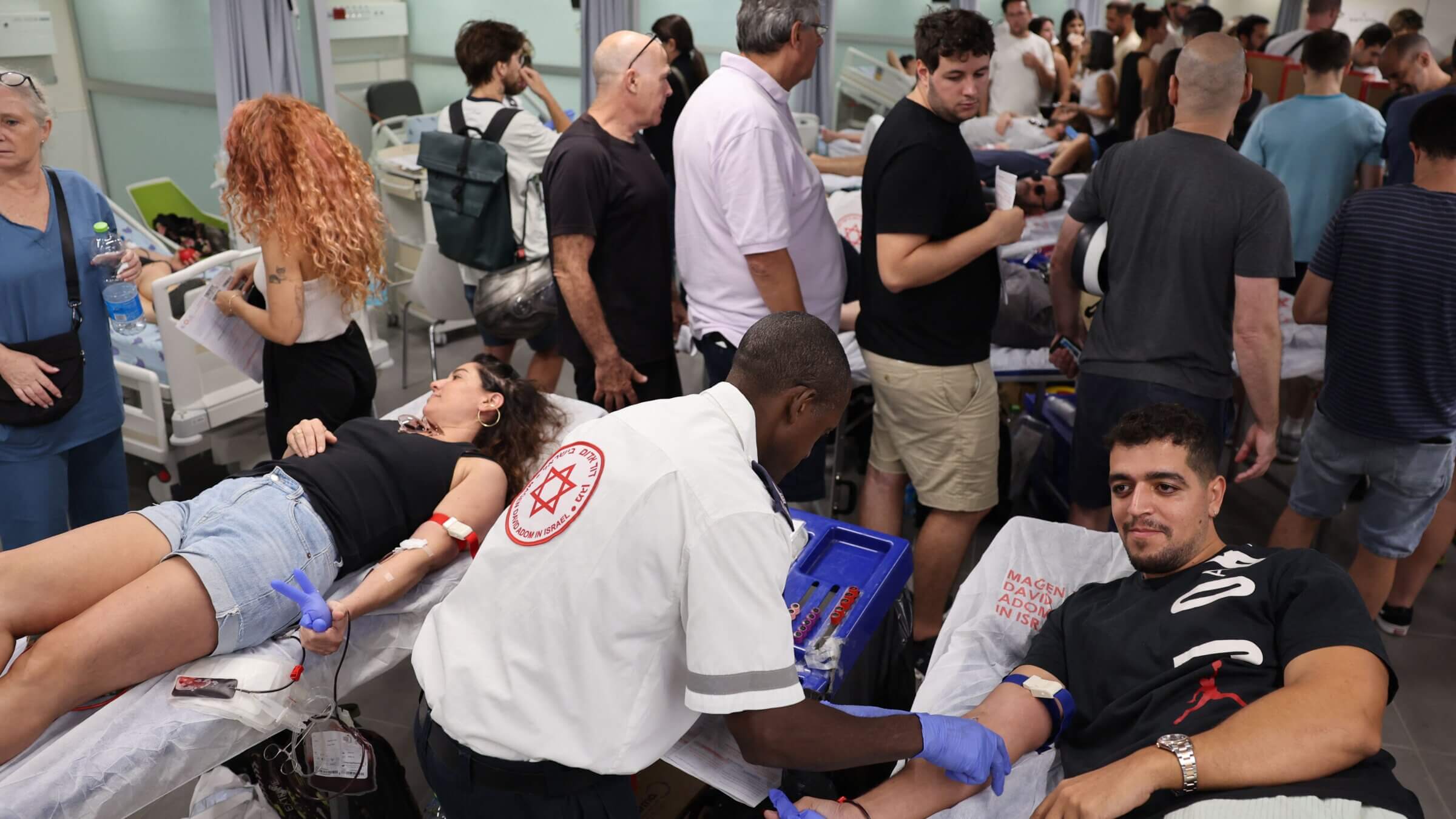 Israelis donate blood at a hospital in Tel Aviv on Oct. 7, 2023, after a barrage of rockets were fired and fighters from the Gaza Strip infiltrated Israel, a major escalation in the Israeli-Palestinian conflict