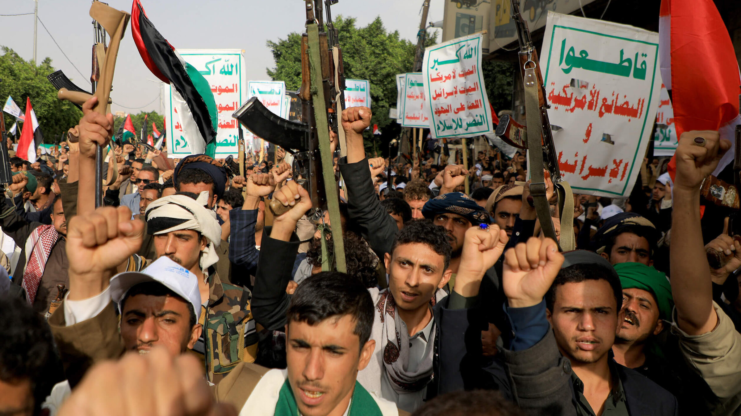 People brandishing weapons take to the streets of Yemen's Huthi-held capital Sanaa on Saturday in support of the Palestinians, after the militant group Hamas launched a surprise large-scale attack against Israel from Gaza.