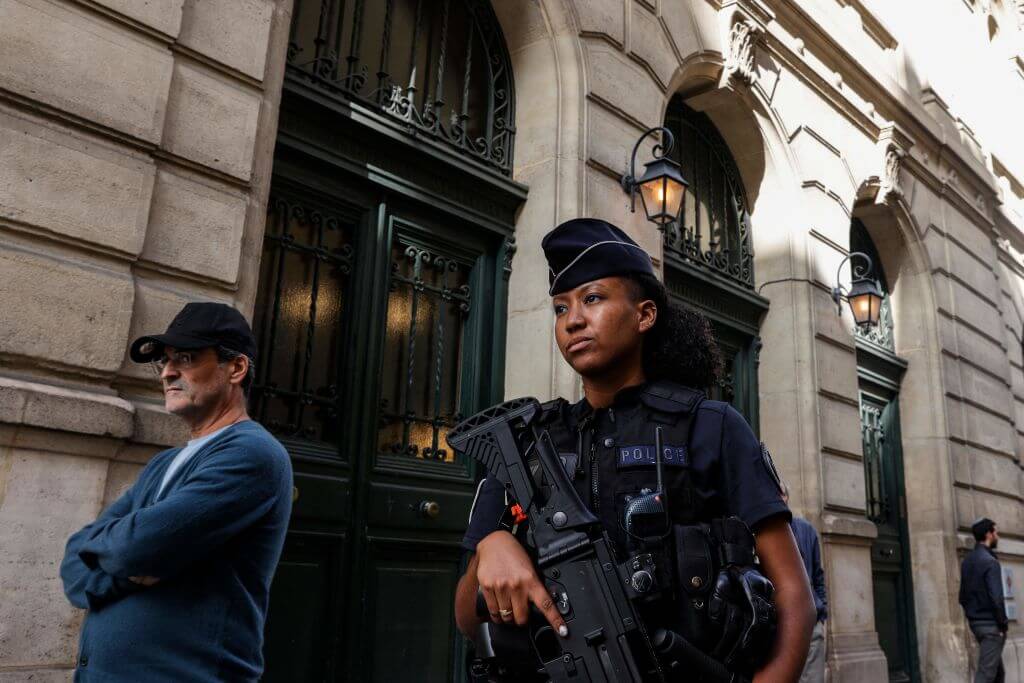 A French police officer patrols outside the Tournelles Synagogue, after increased security measures were put in place at shuls and schools in central Paris, on October 8, 2023. One local Jewish leader expressed concern at the possibility the conflict might be imported there.