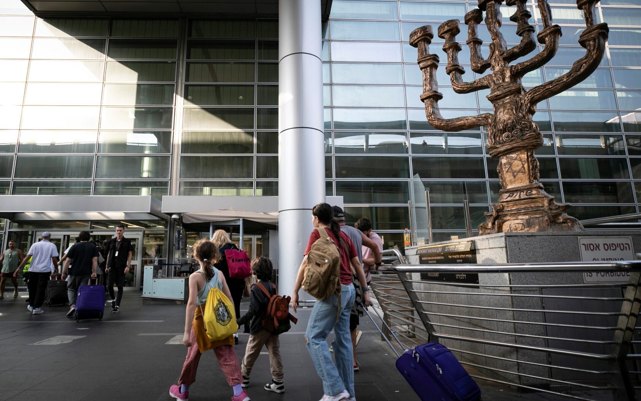 Travelers are seen at Ben Gurion International Airport near Tel Aviv, Israel, Oct. 8, 2023. International airlines delayed or cancelled their flights to and from Israel after an attack by Hamas triggered a war (Chen Junqing/Xinhua via Getty Images)