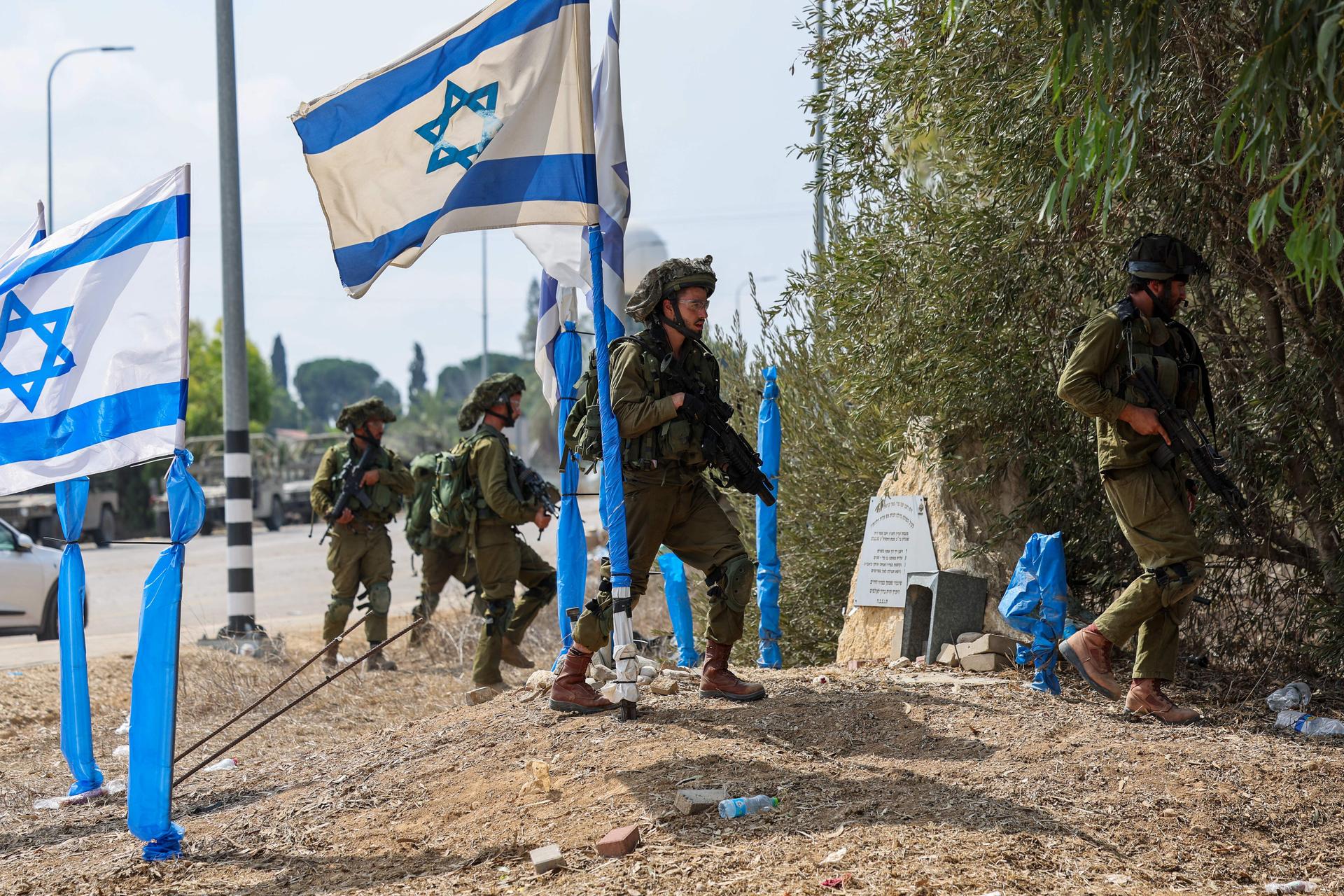 Israeli soldiers patrolled an area in Kfar Aza, which borders the Gaza Strip, on Tuesday. (JACK GUEZ/AFP via Getty Images)