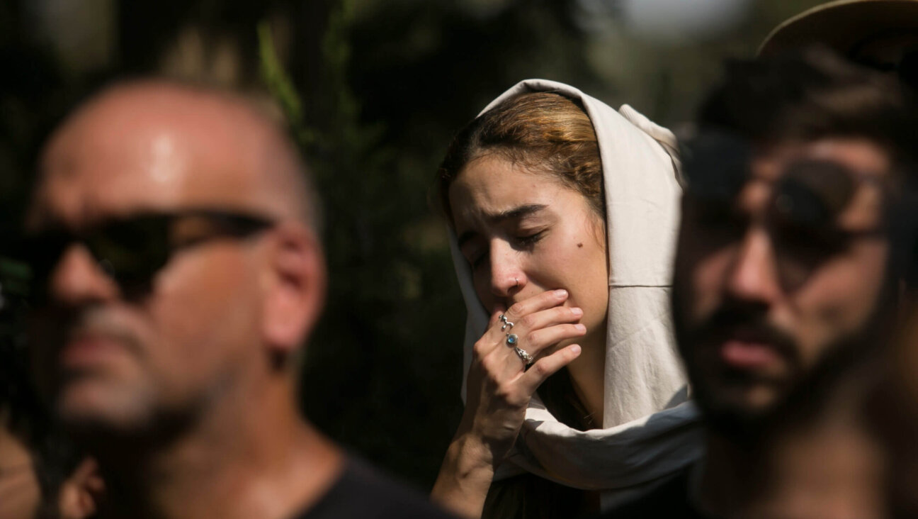 Family and friends of May Naim, 24, who was murdered by Hamas militants at a music festival near the Israeli border with Gaza, react during her funeral on Wednesday in Gan Haim, Israel.  