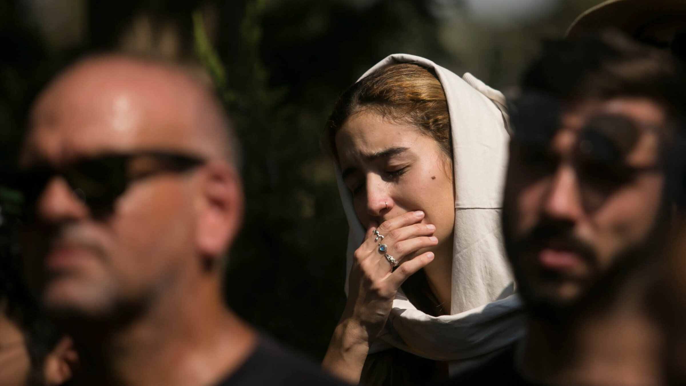 Family and friends of May Naim, 24, who was murdered by Hamas militants at a music festival near the Israeli border with Gaza, react during her funeral on Wednesday in Gan Haim, Israel.  