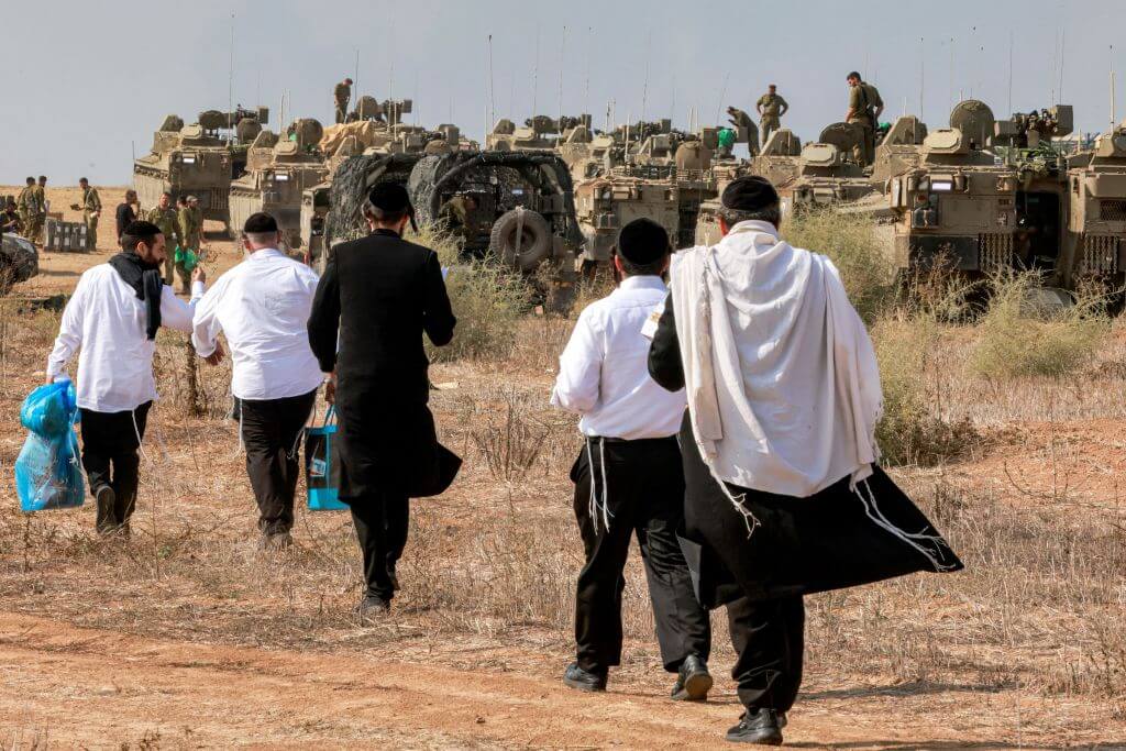 Ultra-Orthodox Jews visit Israeli army soldiers on Oct. 11, 2023. 