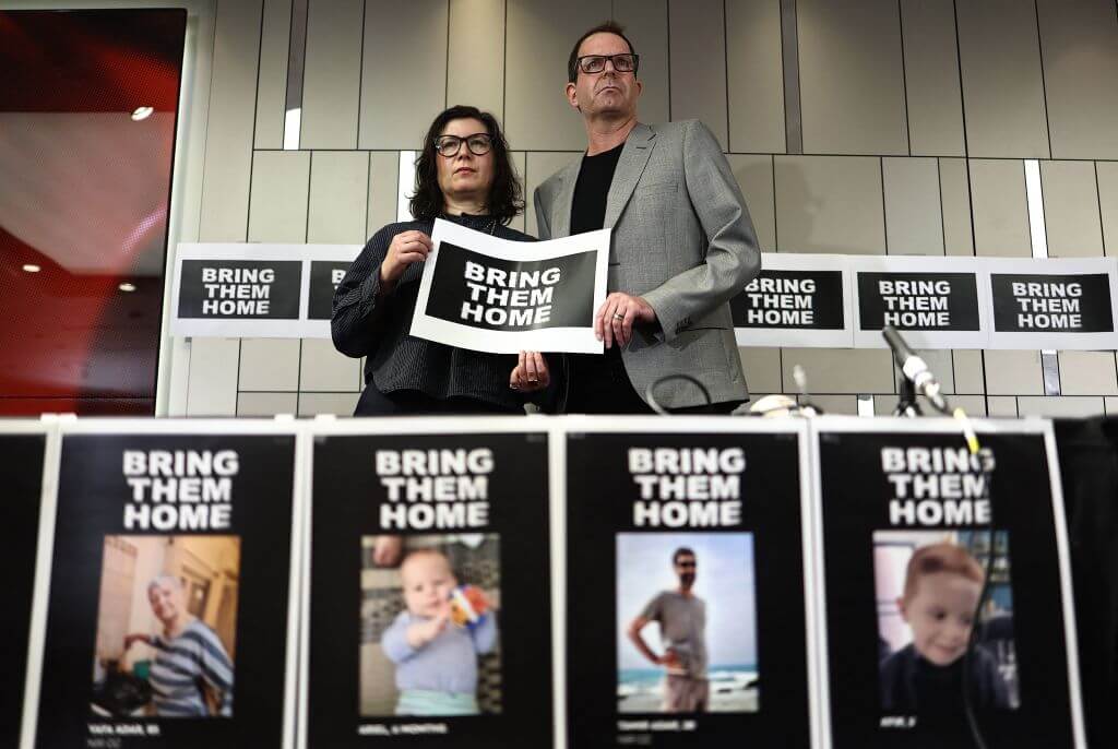 Noam Sagi, right and Sharon Lifschitz, whose respective parents were taken hostage from the Nir Oz Kibbutz during the surprise attack on Israel by Hamas, attend a press conference in London on October 12, 2023. 
