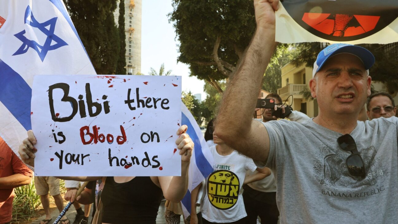 Supporters and family members of Israeli hostages taken by Hamas during a surprise attack on Israel protest outside of the Israeli military base of HaKirya in central Tel Aviv, Oct. 14, 2023. (Gil Cohen-Magen/AFP via Getty Images)
