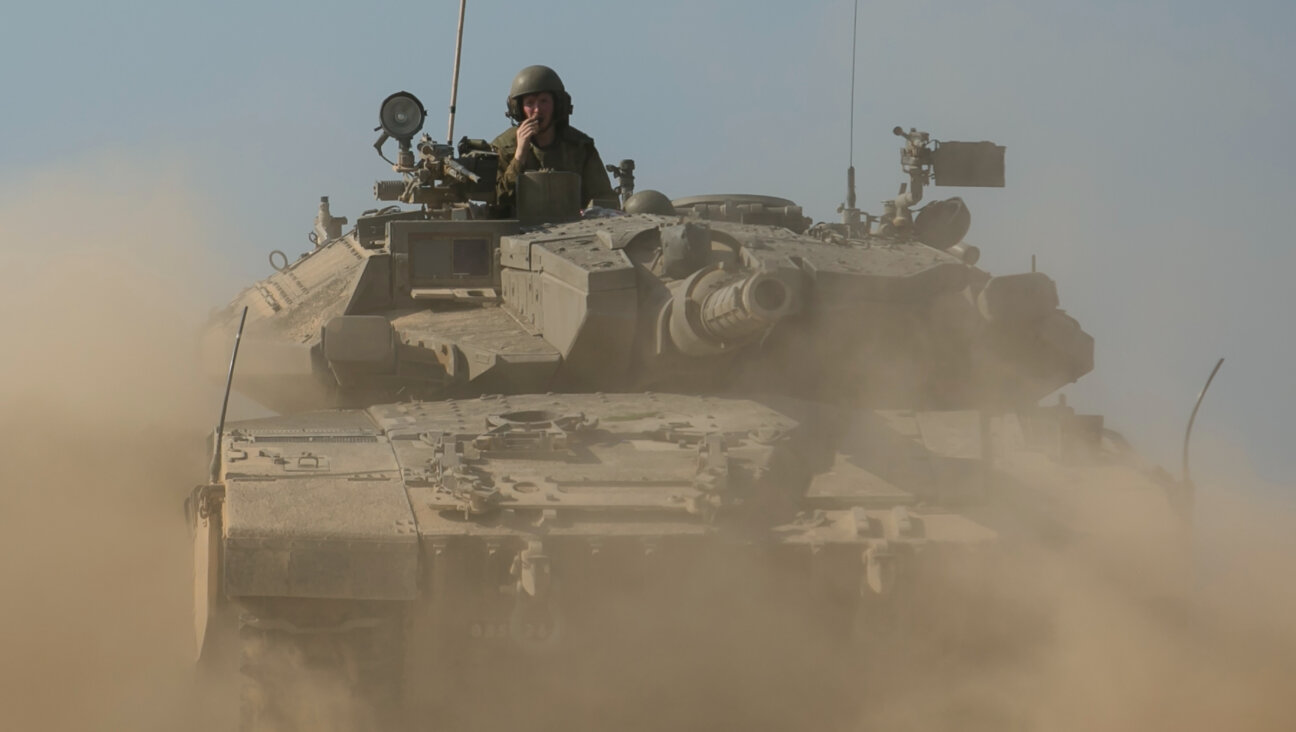 Israeli tank moves near the border with Gaza on October 14, 2023.