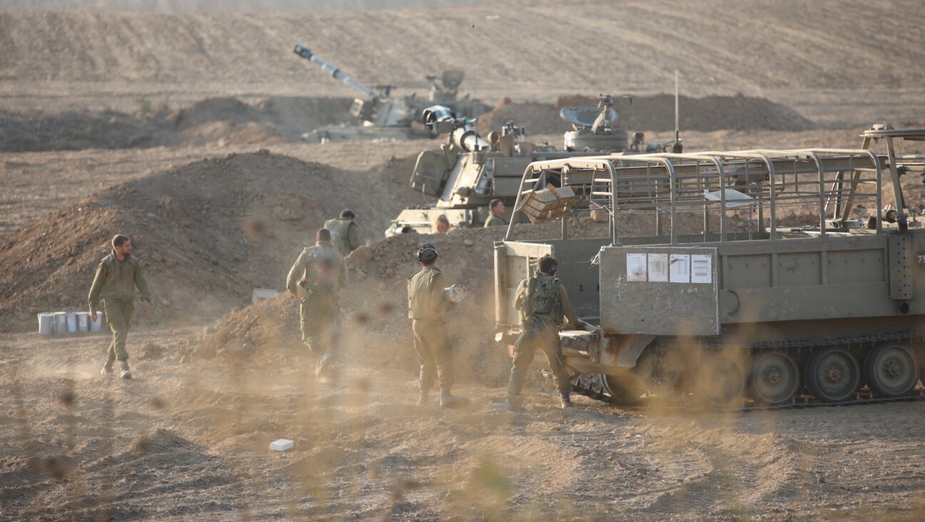 Israeli troops and armored vehicles near the Gaza border in Sderot on October 14, 2023. (Metin Yuksel Kaya/Anadolu via Getty Images)