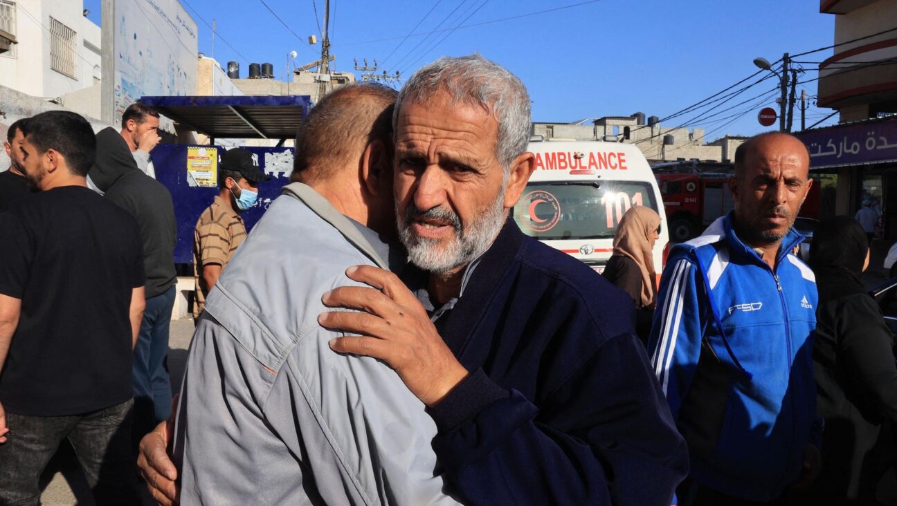 Mourners attend the Sunday funeral of members of the Zannoun family killed in an Israeli airstrike that hit a refugee camp in the southern Gaza Strip. (SAID KHATIB / AFP) 