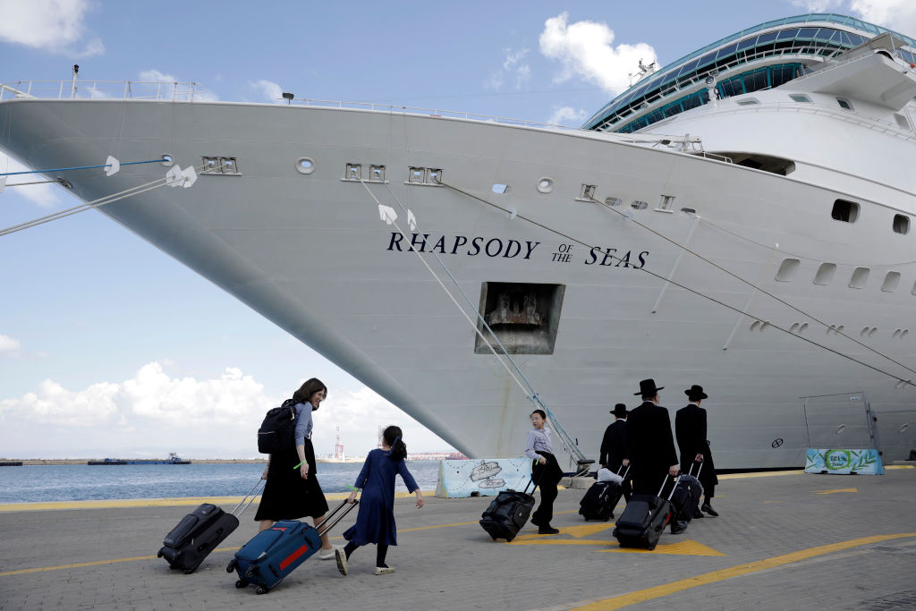 U.S. citizens and their families arrive Monday at the port in Haifa, Israel, to board a ship bound for Cyprus. (Getty)