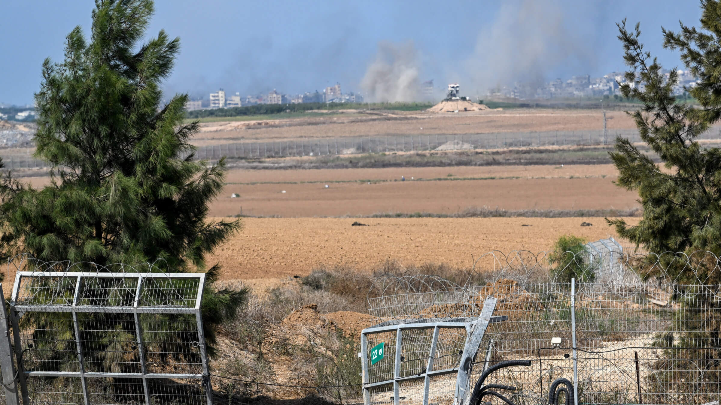 Smoke rises in the distance from Gaza near the spot where Hamas militants broke through the fence near the Gaza border.