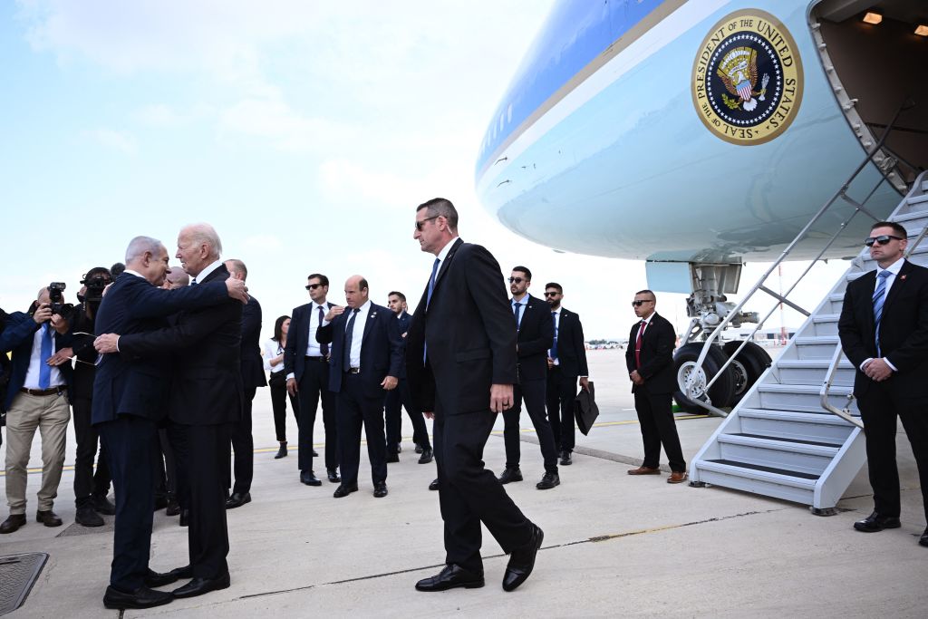 Israel Prime Minister Benjamin Netanyahu, left, hugs President Joe Biden upon his arrival in Israel Wednesday. (Getty)