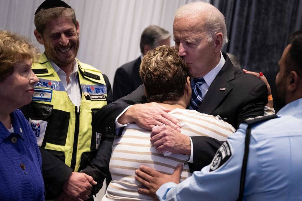 President Joe Biden hugs Hamas attack survivor on Oct. 18, 2023. 