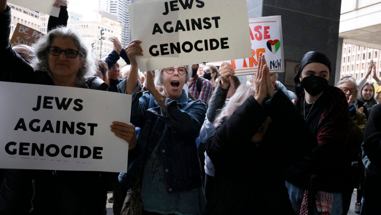 Protesters cheer as they rally outside of the John F. Kennedy Federal Building in support of six Jewish protesters who were stopped inside the hallway while trying to get to Sen. Elizabeth Warren’s office where they had planned to stage a sit in and “call for U.S. action to prevent genocide in Gaza,” Oct. 18. 2023. 