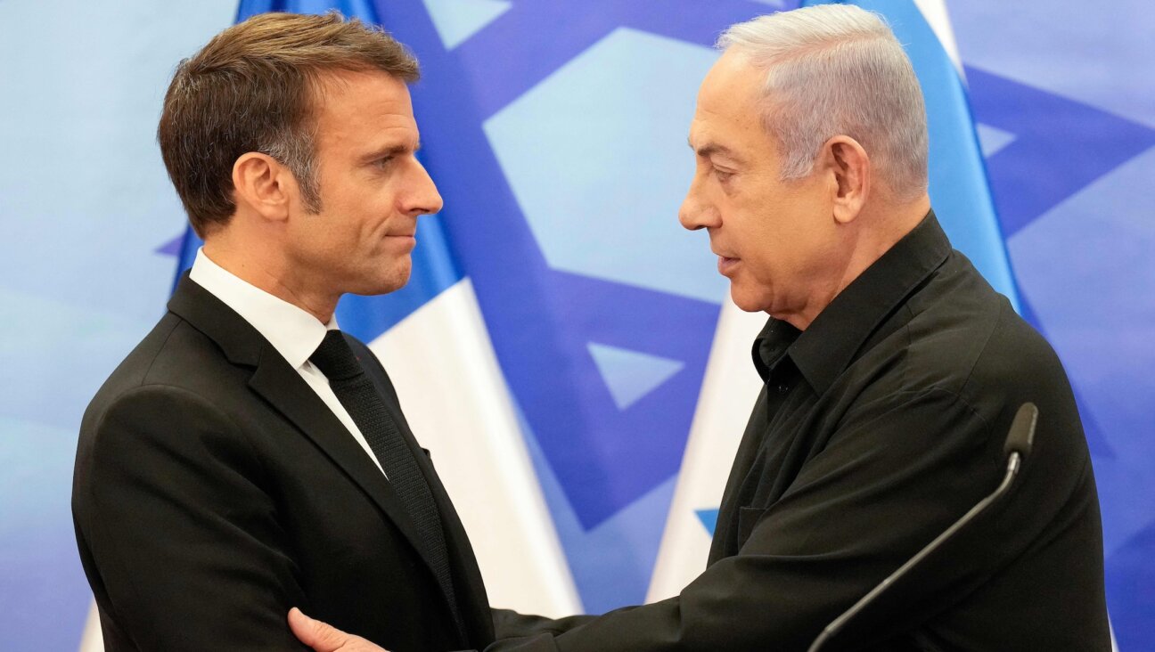 French President Emmanuel Macron shakes hands with Israeli Prime Minister Benjamin Netanyahu after their joint press conference in Jerusalem, Oct. 24, 2023. (Christophe Ena/Pool/AFP via Getty Images)