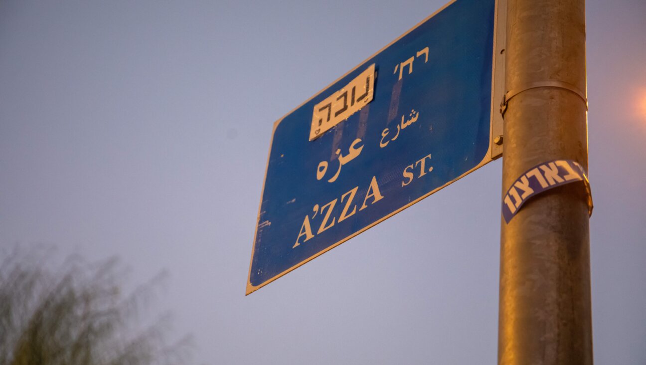 A sign for Azza Street (Hebrew for "Gaza") with the name "Nova" — the party where a massacre took place in which hundreds of revelers were murdered Oct. 7 — taped on.