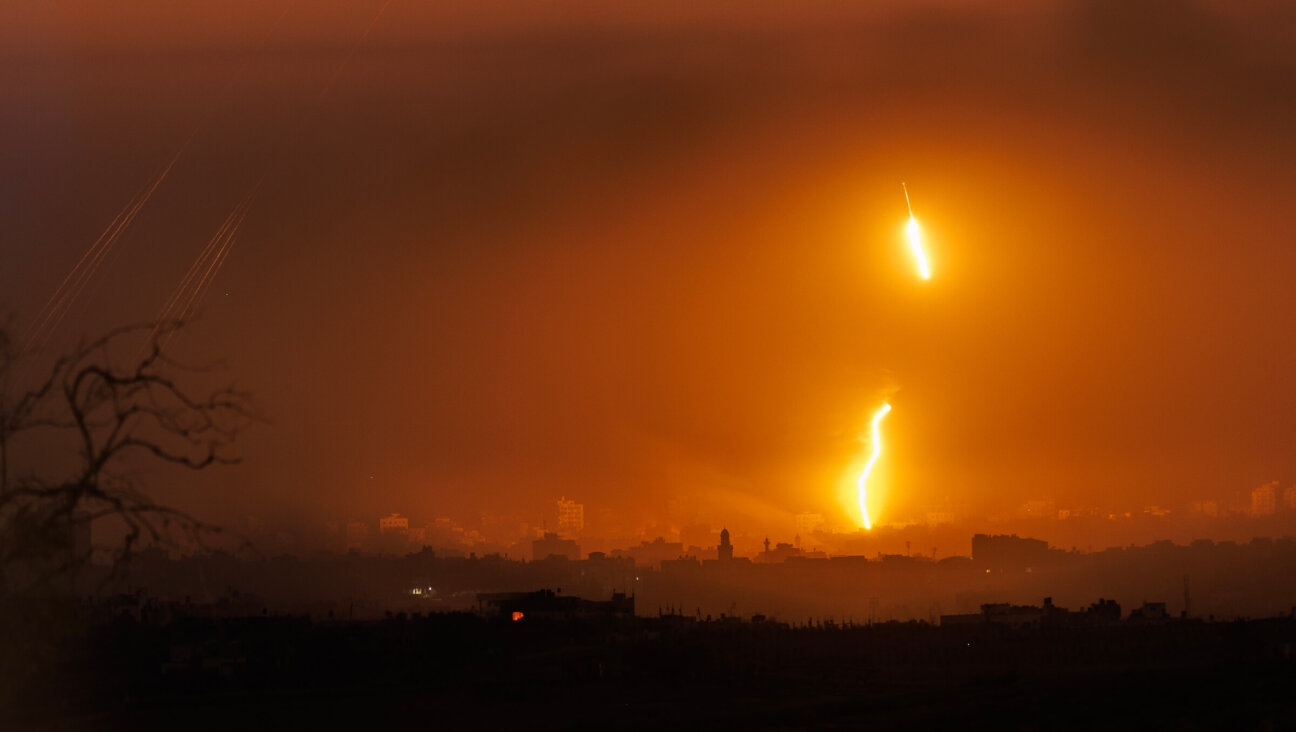 Rockets and "light bombs" seen over the Gaza strip from Sderot on Monday.