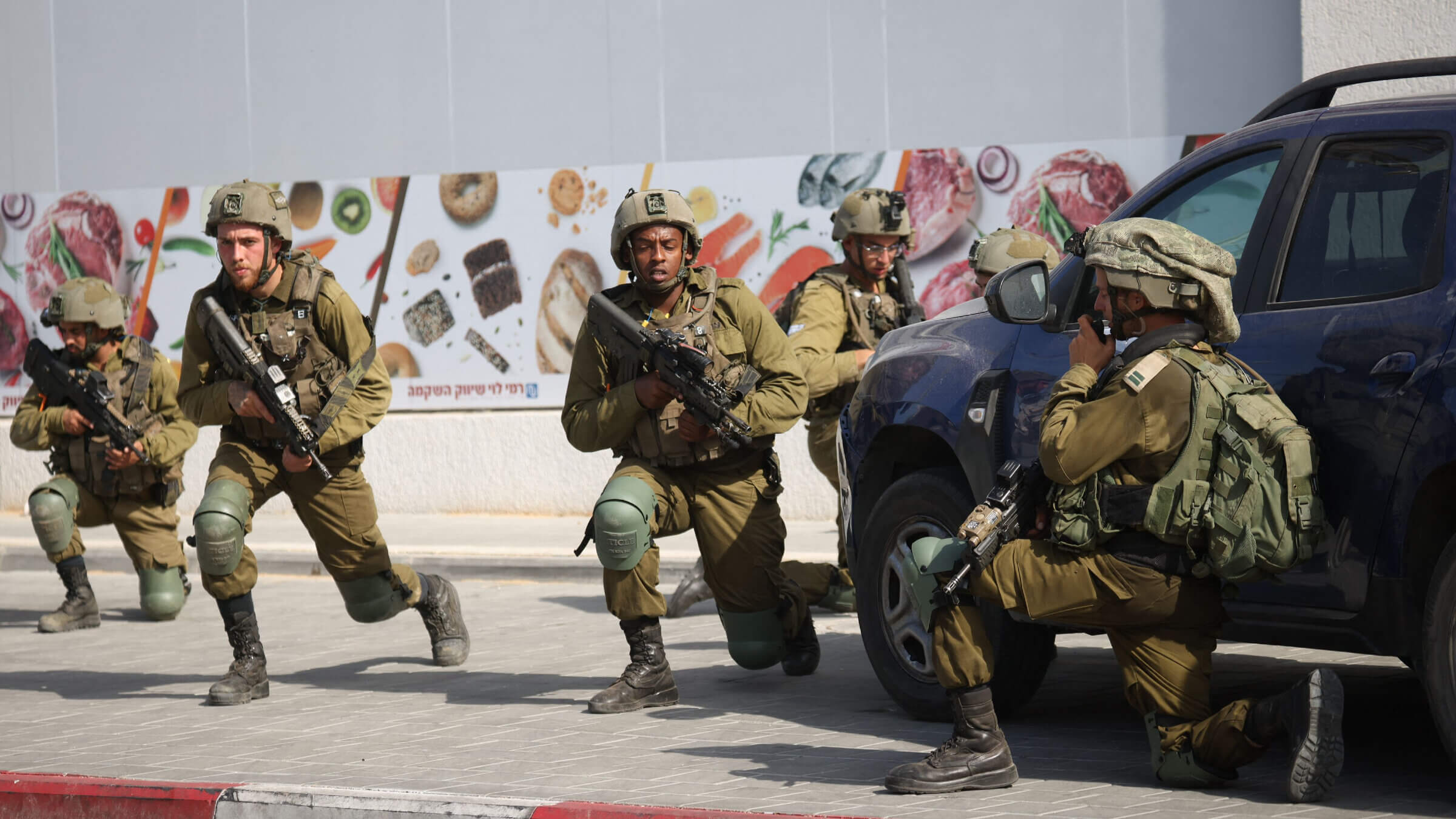 Israeli soldiers deploy in an area where civilians were killed in the southern city of Sderot on Oct. 7, 2023. 