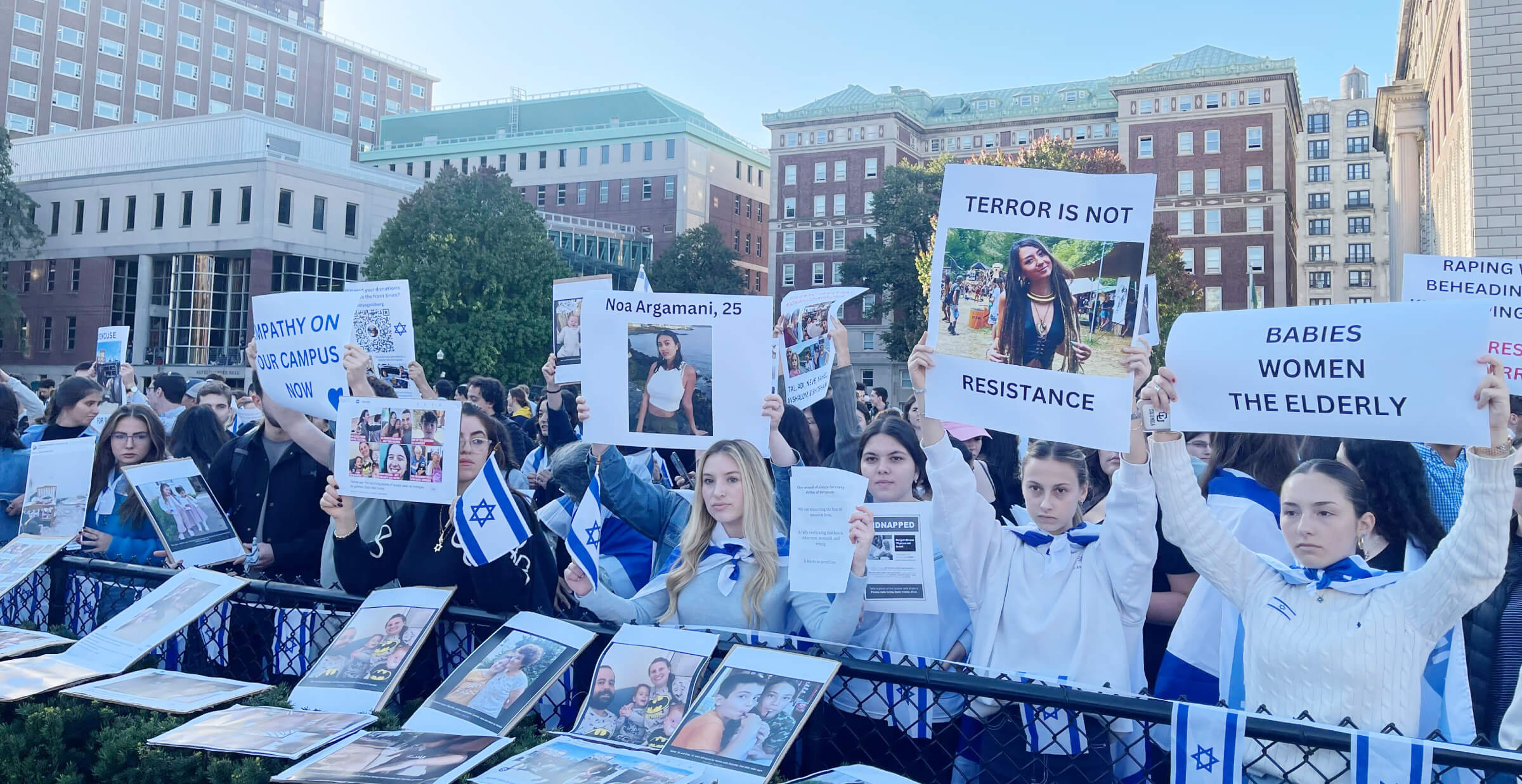 Students at a pro-Israel protest at Columbia University on Thursday, Oct. 12, hold up photos of Israelis kidnapped by Hamas.