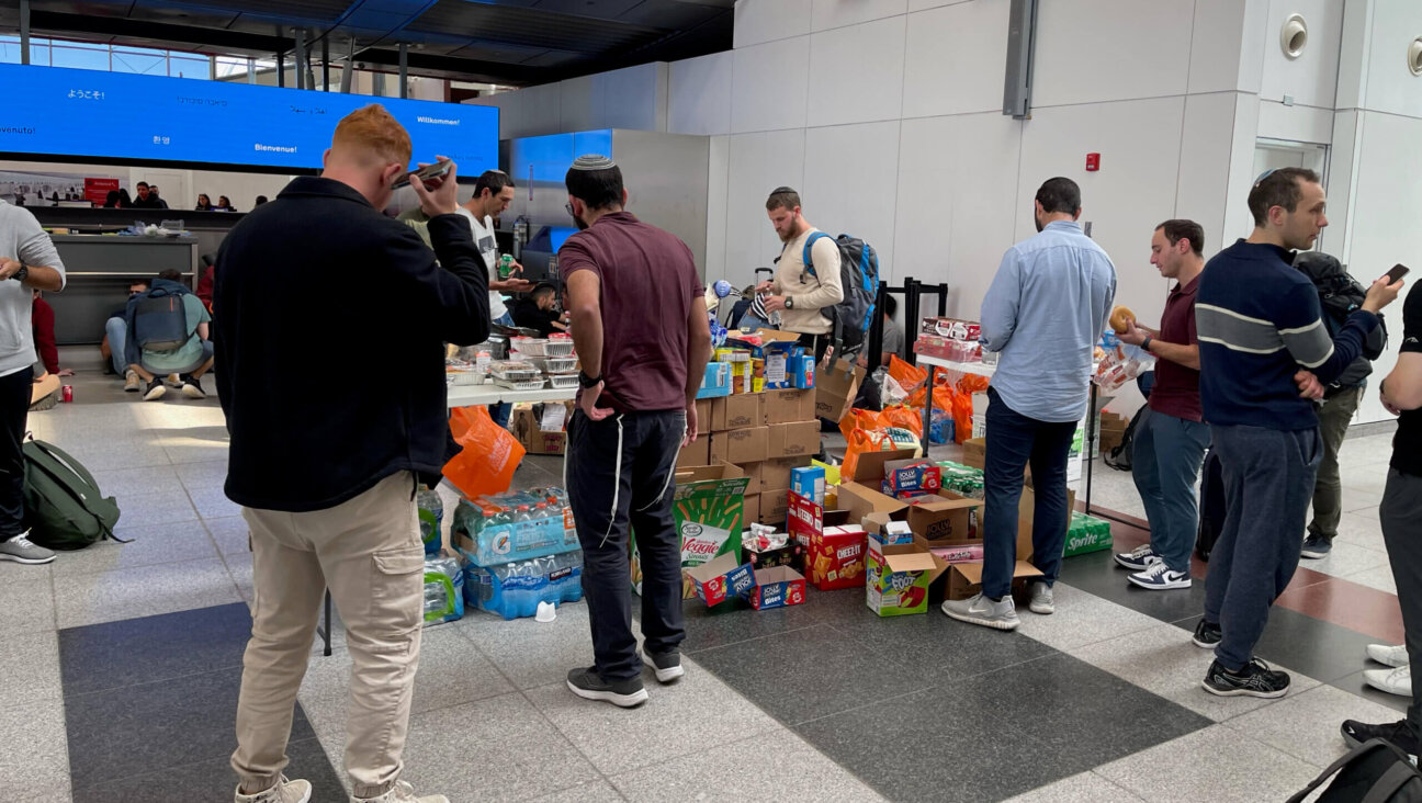 Volunteers from Brooklyn set up tables laden with snacks, flashlights and other supplies for Israeli soldiers and others headed to Israel on Monday at John F. Kennedy International Airport in New York, two days after Hamas launched the most serious attack on Israel in decades.