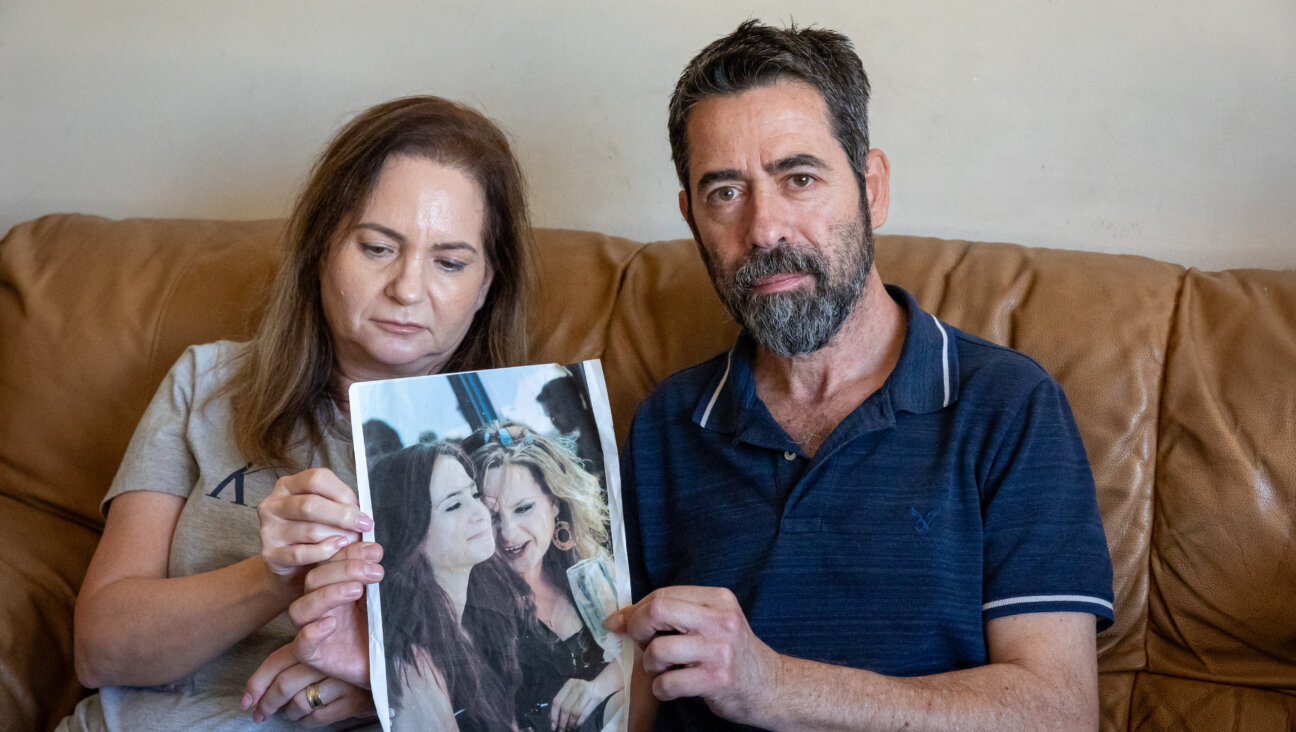Ifat and Haim Haiman, of Petah Tikva, Israel, hold a picture of Ifat and their daughter Inbar. She was captured at the Nova music festival by Hamas terrorists on Oct. 7, 2023.