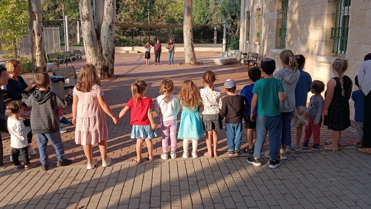Teens play with children in Jerusalem during the weeks after Hamas’ Oct. 7, 2023, attack on Israel. (Odelia Kaye)