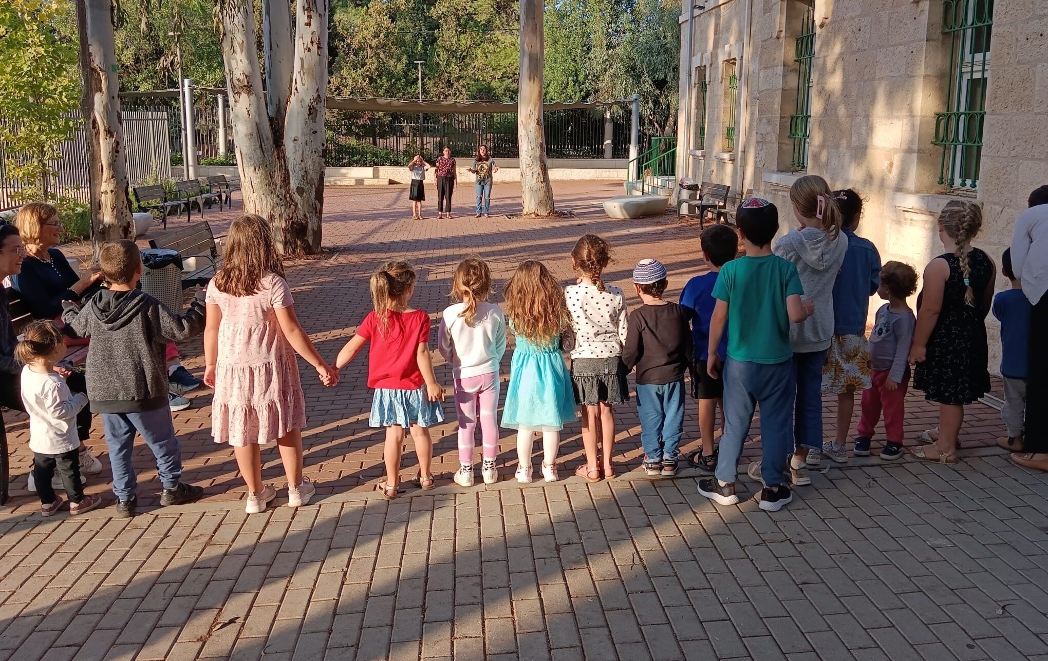 Teens play with children in Jerusalem during the weeks after Hamas’ Oct. 7, 2023, attack on Israel. (Odelia Kaye)