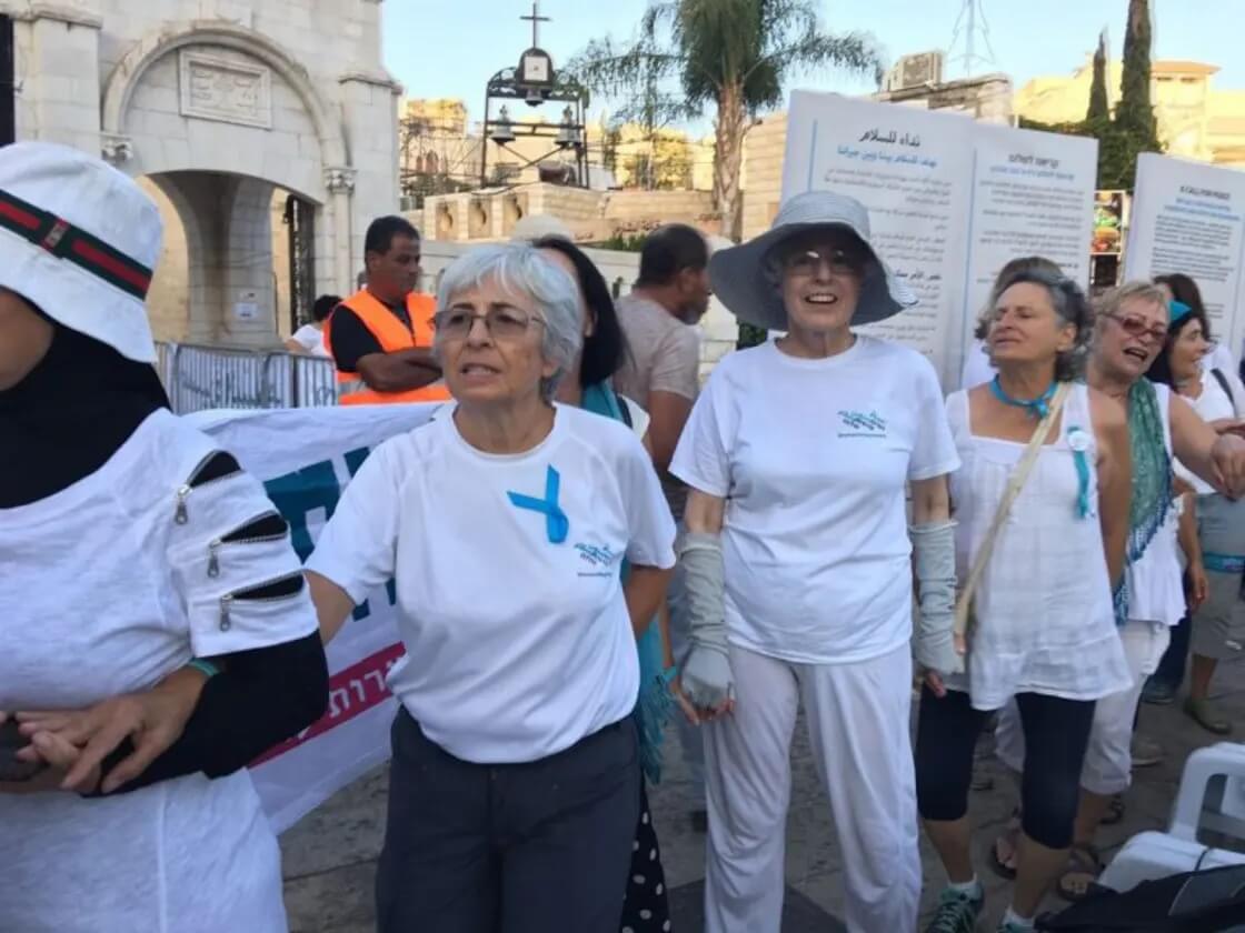 Vivian Silver, center left, marches in a demonstration with Women Wage Peace, an organization that she co-founded that centers women in Israel-Palestinian peacemaking.