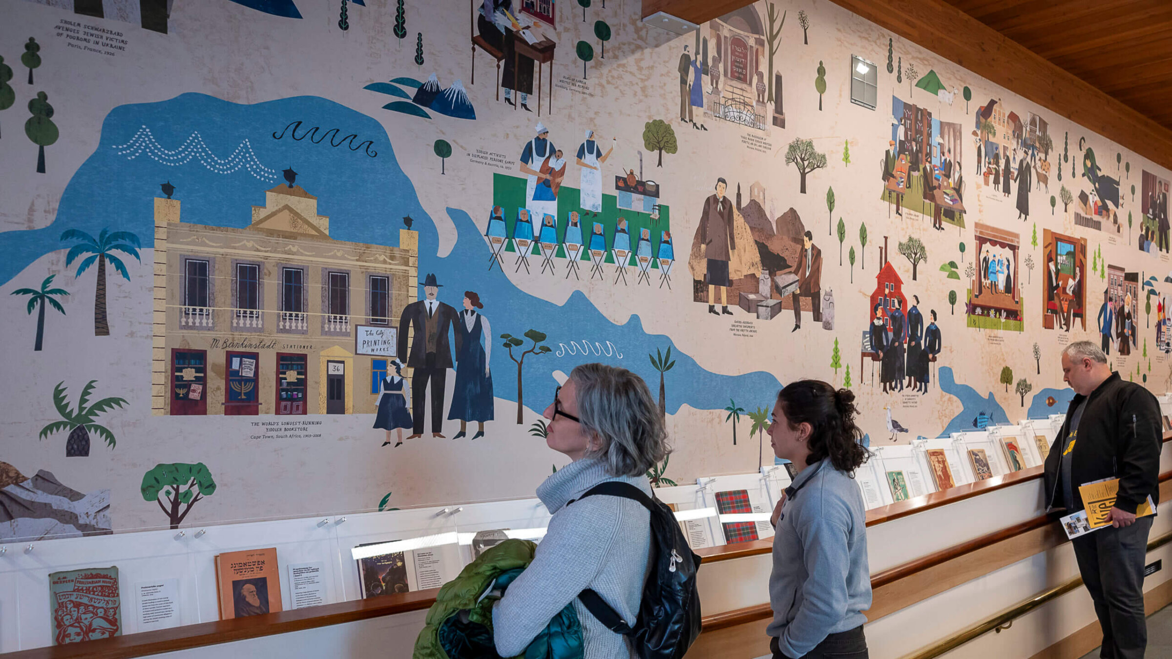 A colorful 60-foot mural depicting the history of Yiddish culture, commissioned for the Yiddish Book Center's new permanent exhibit from German illustrator Martin Haake.