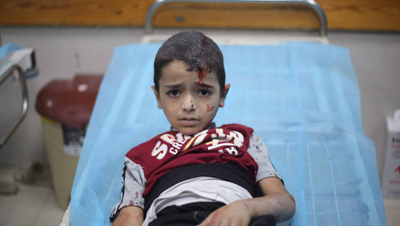 A Palestinian child injured in Israeli air raids, Oct. 18, 2023 in Khan Yunis.
