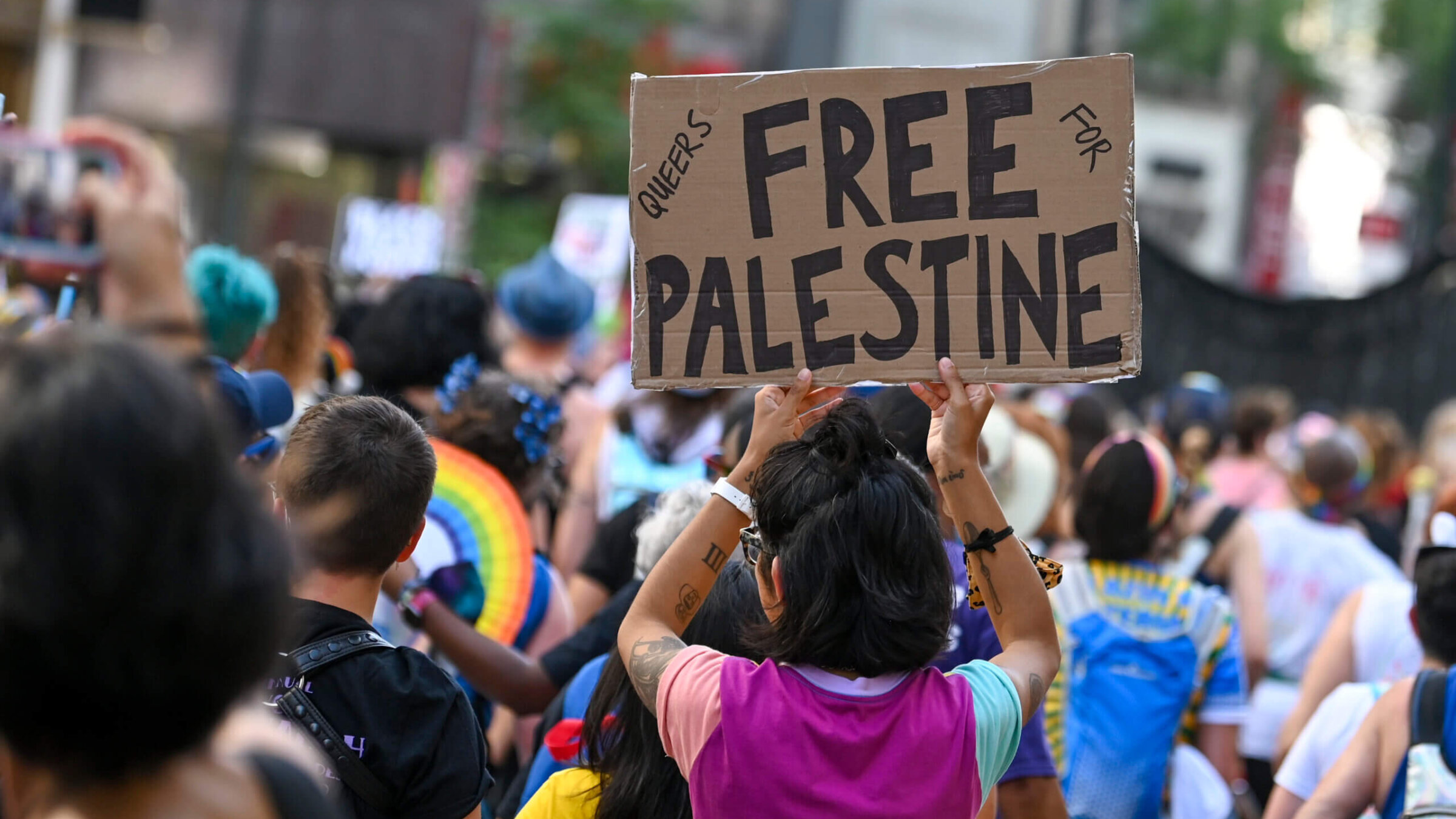 A person carries a "Queers for Free Palestine" sign at the 29th Annual New York City Dyke March on June 26, 2021 in New York City. 