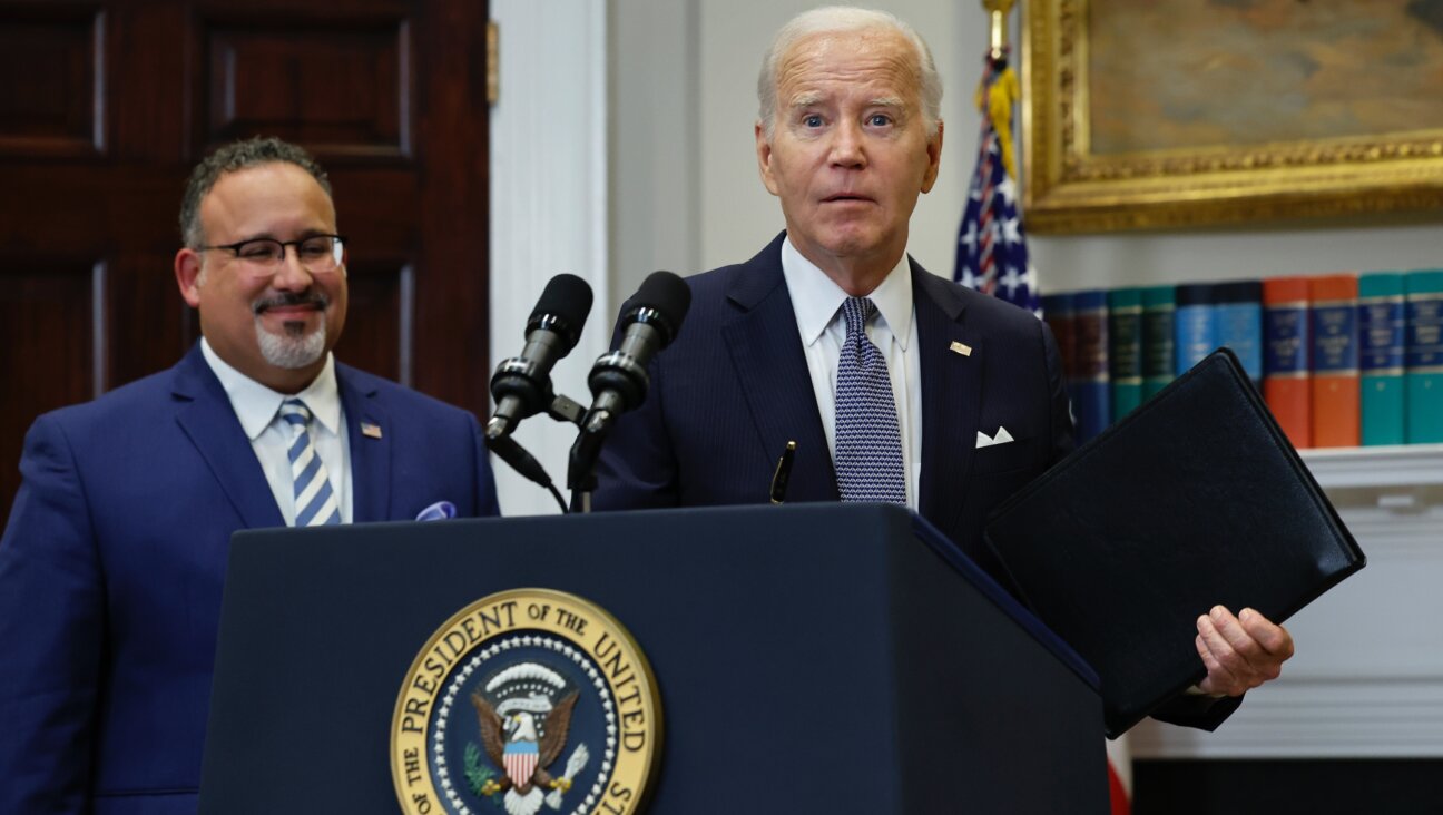 U.S. President Joe Biden is joined by Education Secretary Miguel Cardona as he announces new actions to protect borrowers after the Supreme Court struck down his student loan forgiveness plan in the Roosevelt Room at the White House, June 30, 2023. ( Chip Somodevilla/Getty Images)