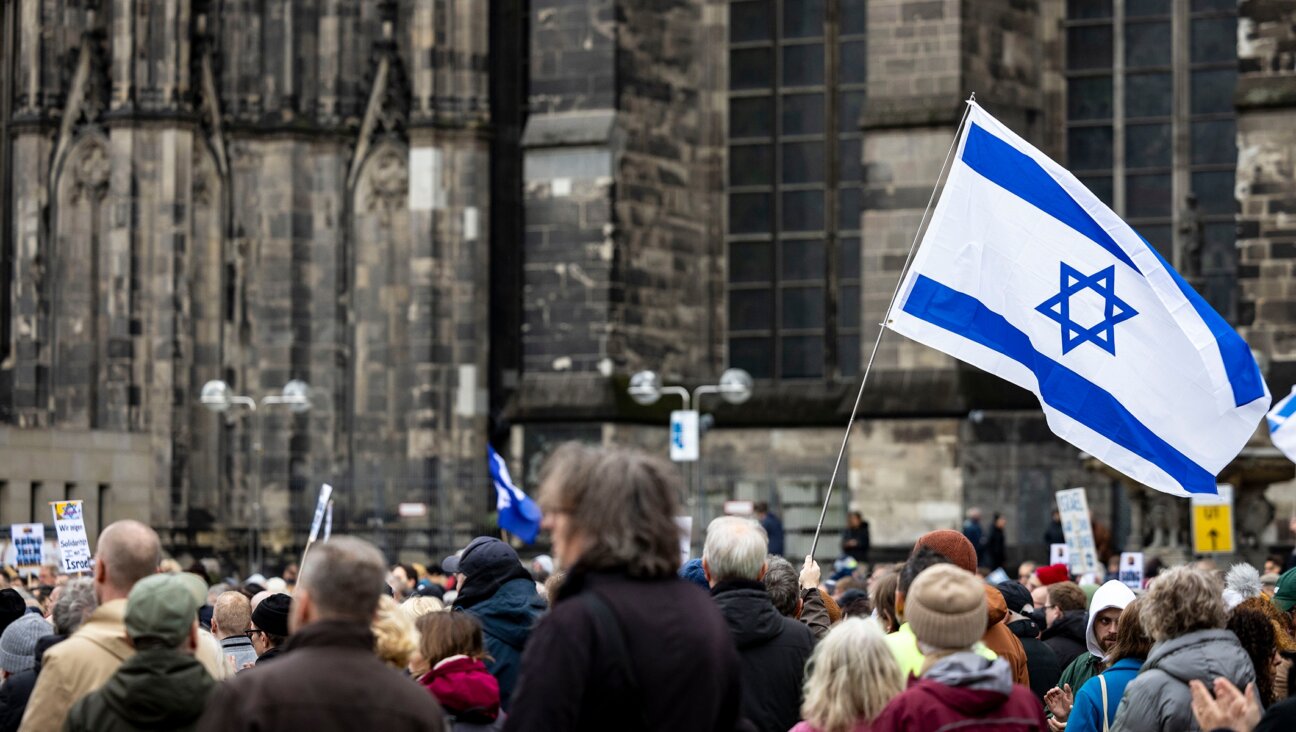 Israeli flags wave at a solidarity rally for Israel in Cologne, Germany, Nov. 5, 2023. (Christoph Reichwein/picture alliance via Getty Images)