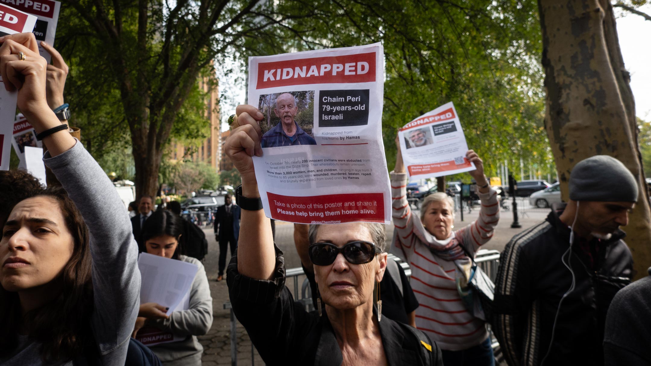 Israel supporters hold images of Hamas hostages at a rally demanding their release, in New York City, October 18, 2023. (Luke Tress)