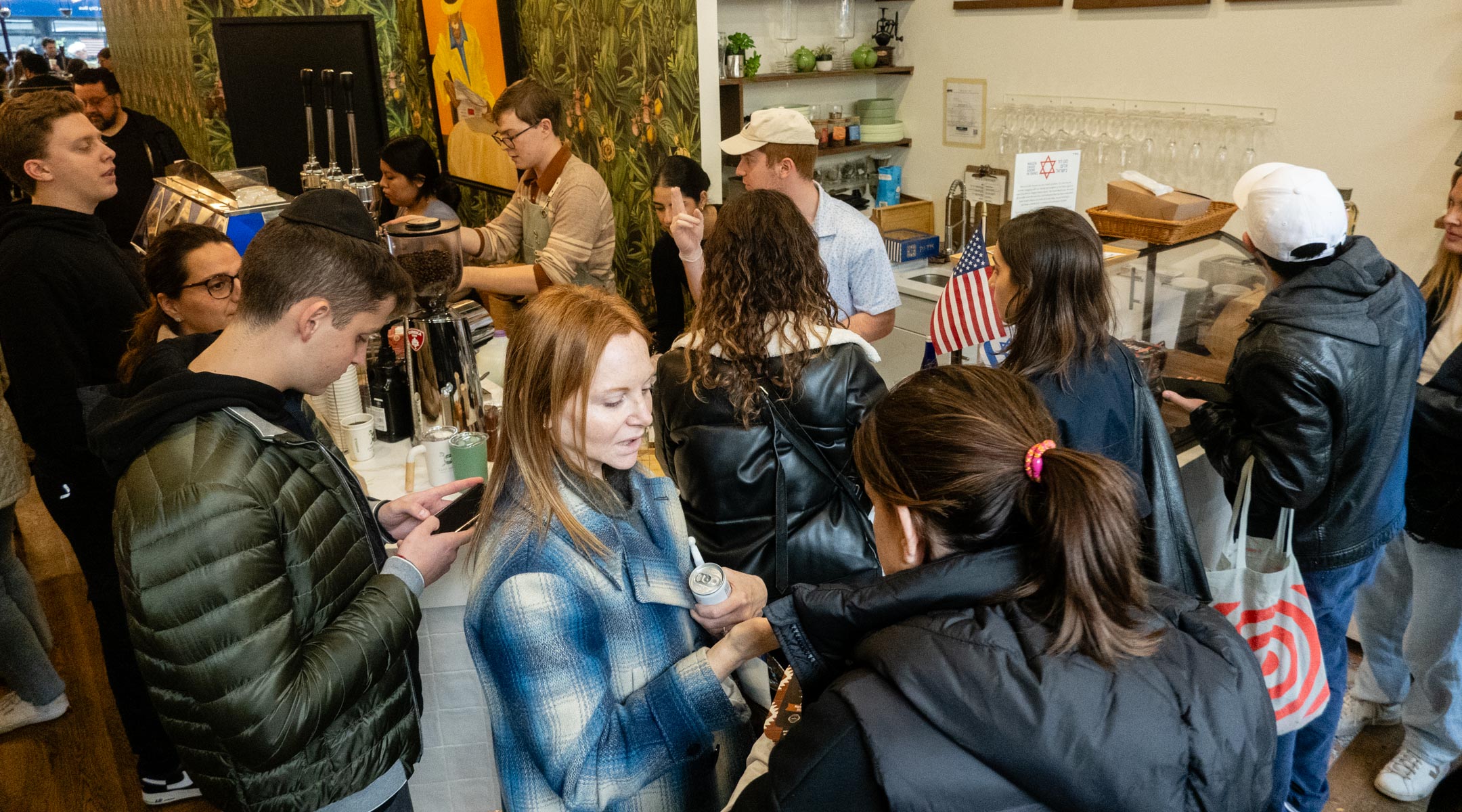Customers pack into Caffe Aronne in the Upper East Side after staff members quit due to the store’s pro-Israel activities, Nov. 7, 2023. (Luke Tress)