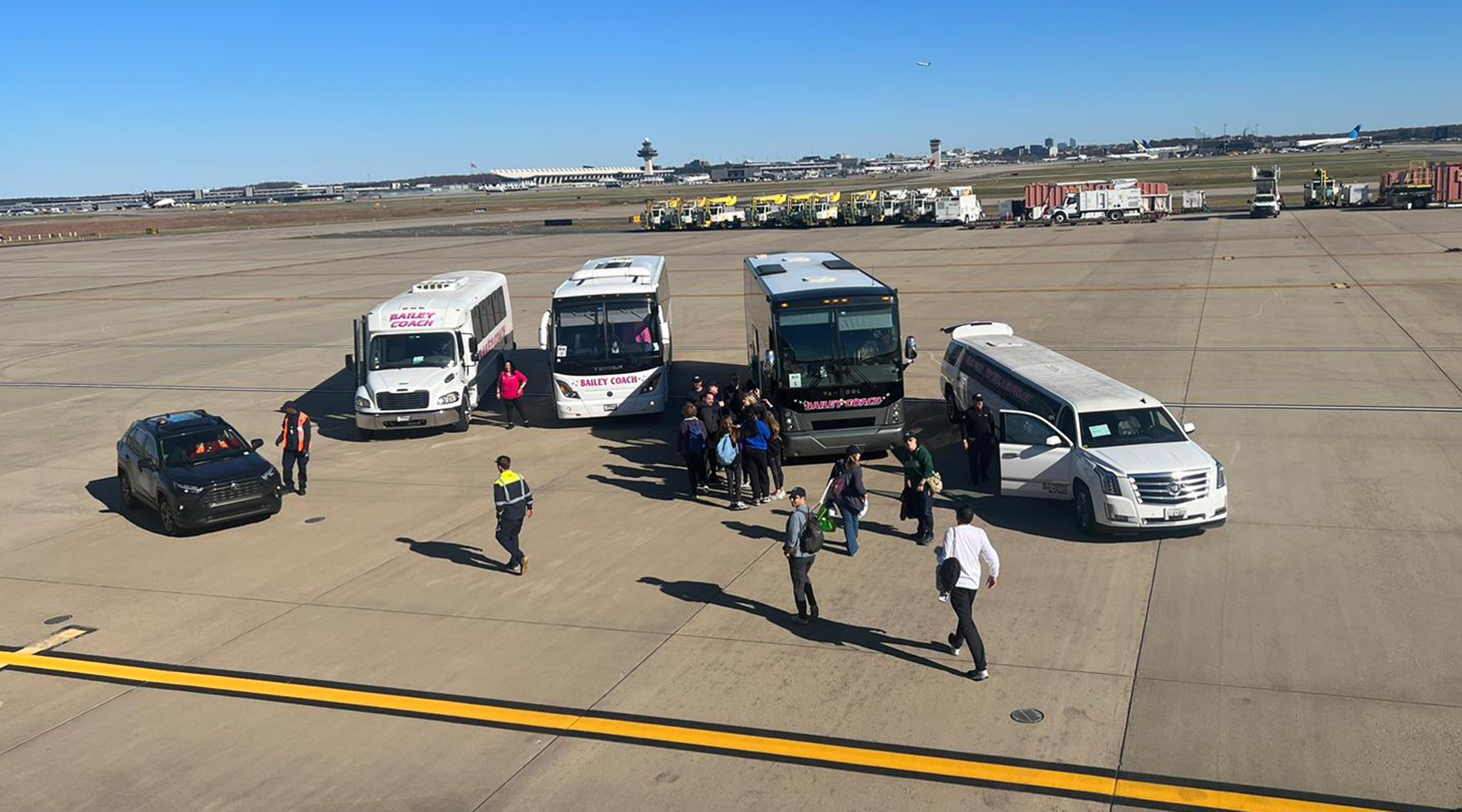 Makeshift buses, including a rented limousine, arrive to replace the ones hired by the Jewish Federation of Metropolitan Detroit, in this picture taken from a plane chartered by the federation to the March for Israel, Nov. 14, 2023. (Courtesy of Jennie Levy)
