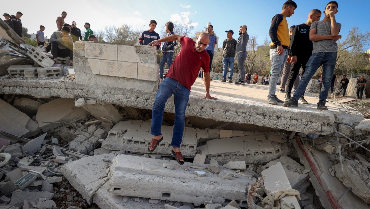 Palestinians inspect the demolished family home of Saleh al-Arouri, in the West Bank village of Arura, near Ramallah, on October 31, 2023.(FLASH90)